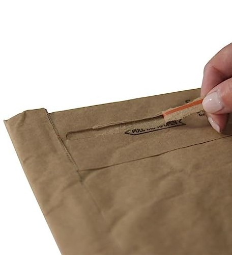 Paper mailer pull tab being pulled